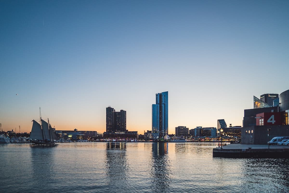 City skyline across body of water during daytime — Baltimore, MD