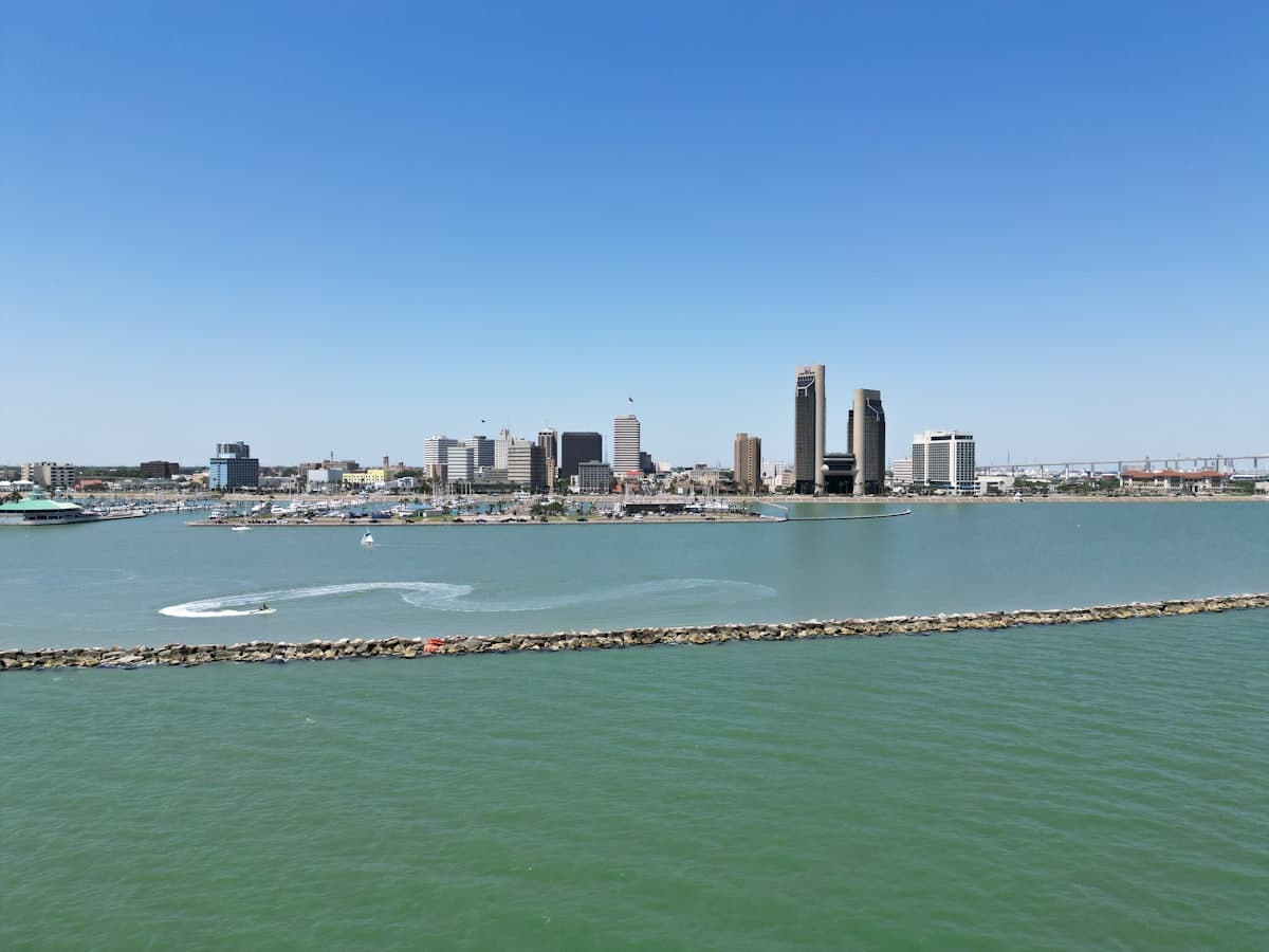 A city skyline is seen across the water — Corpus Christi, TX