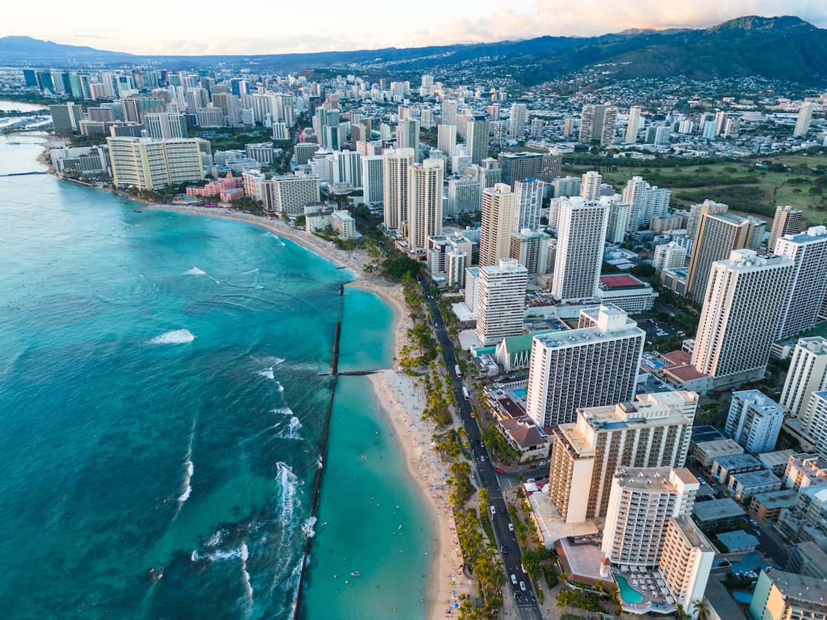An aerial view of a city next to the ocean — Honolulu, HI