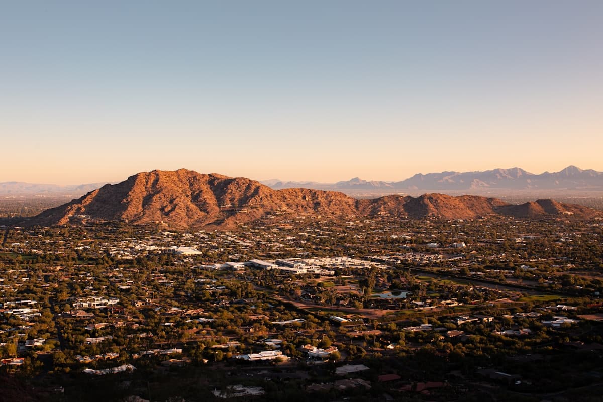 An aerial view of a city with mountains in the background — Mesa, AZ