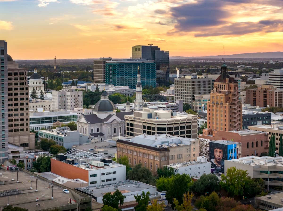 City skyline with modern buildings at sunset — Sacramento, CA