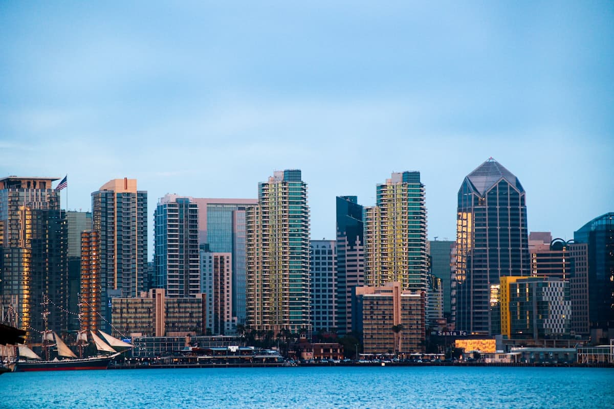 White boat on sea near city buildings during daytime — San Diego, CA